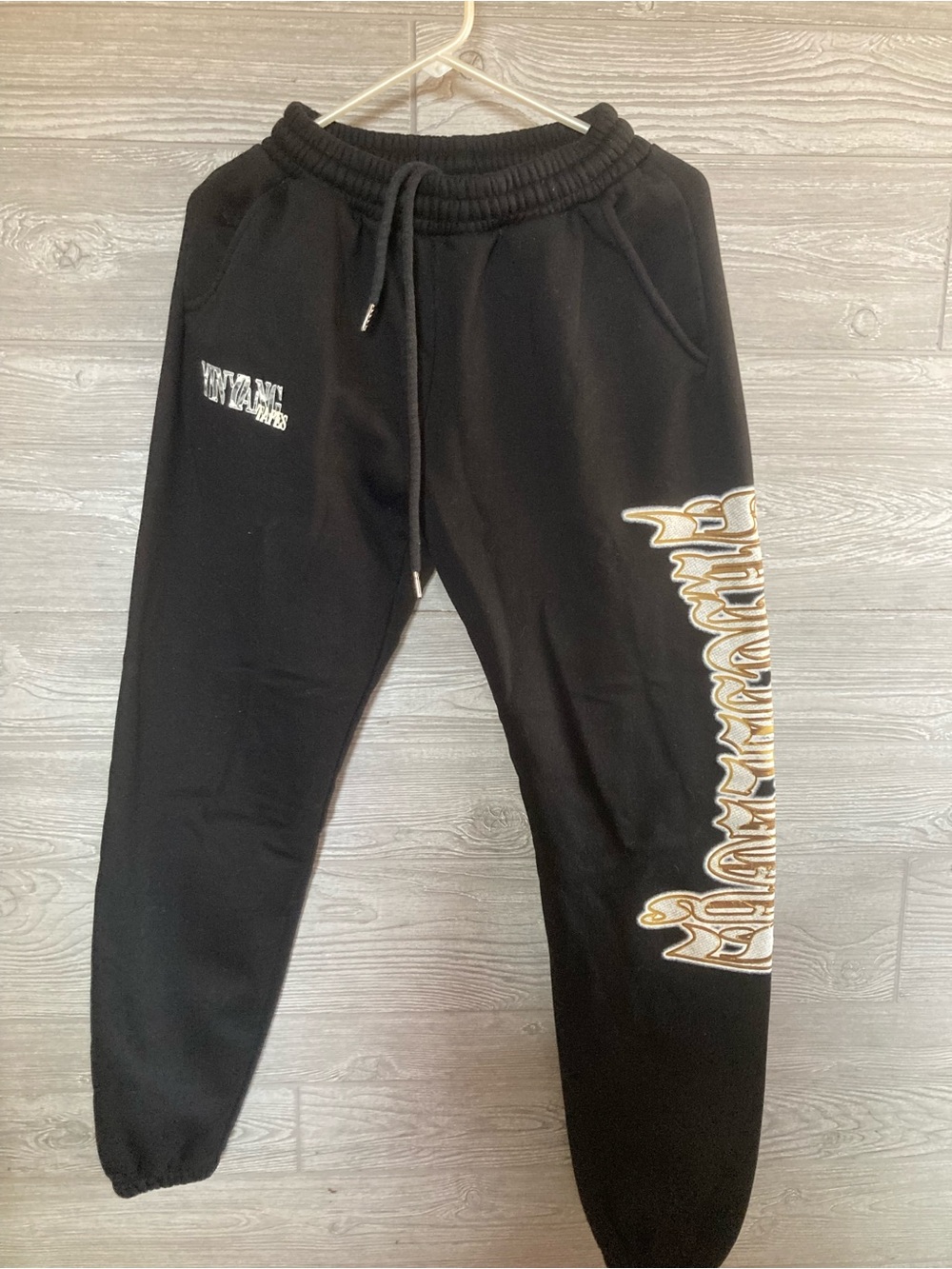 Yin Yang Tapes Black Joggers with Gold Script thingy on side!!